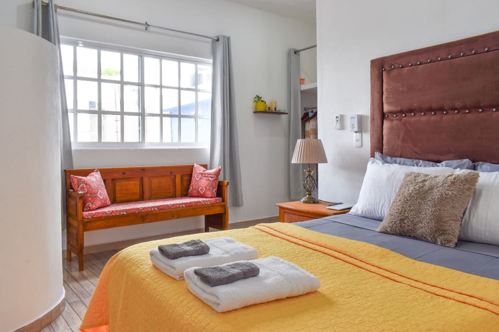 Diana apartment at Perfect Place — bright bedroom with a window bench and natural light